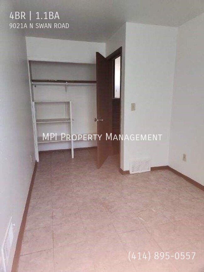 Building Photo - 9021 N Swan Rd