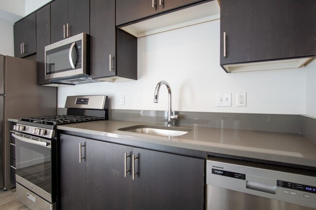 Building Photo - APPS ON US! Modern & Sleek One-Bedroom Tow...