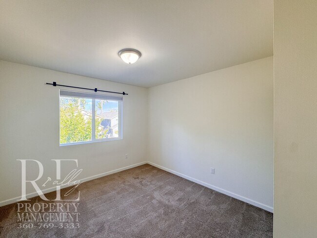 Building Photo - Spacious 3-Story Home with Flexible Living Space, Heat Pump & Private Deck Retreat