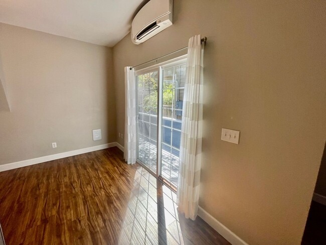 Building Photo - Prime Location! Modern 2BD/1 BA with A/C & EV Charging Steps from Mississippi