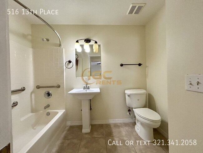 Building Photo - 516 13th Pl
