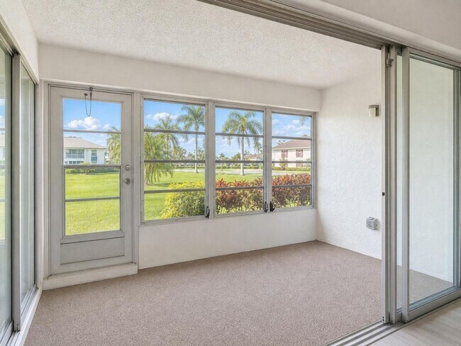 Building Photo - AVAILABLE NOW! Beautifully Renovated First-Floor Condo with Peaceful Screened Lanai