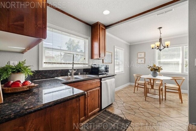 Building Photo - Welcome to this stunning 4-bedroom, 2-bath...