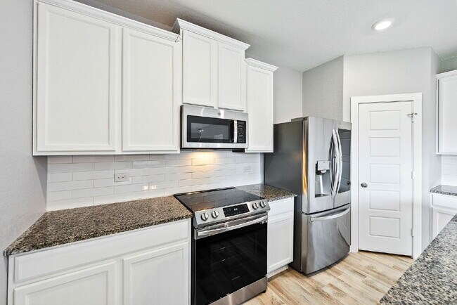 Building Photo - 4 Bedroom Corner Lot Rental with Spacious ...