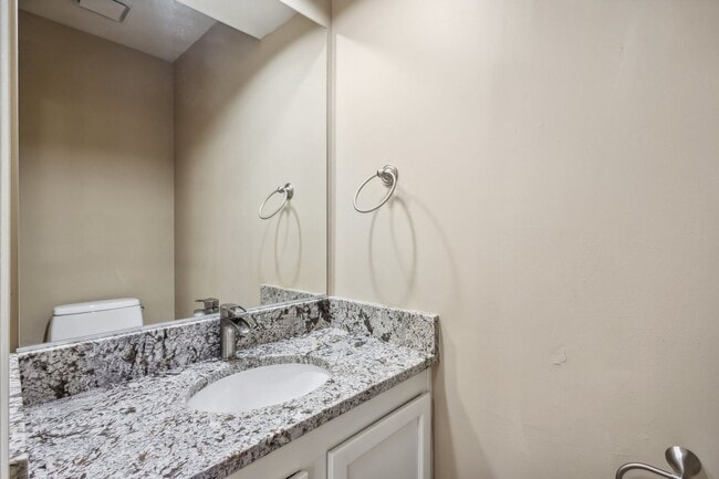 Building Photo - Modern Brick End-Unit Townhome with Stunning Upgrades and Serene Wooded Views