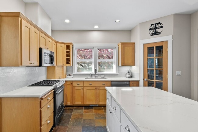 Building Photo - **Spacious 4-Bedroom Craftsman Home on Awb...
