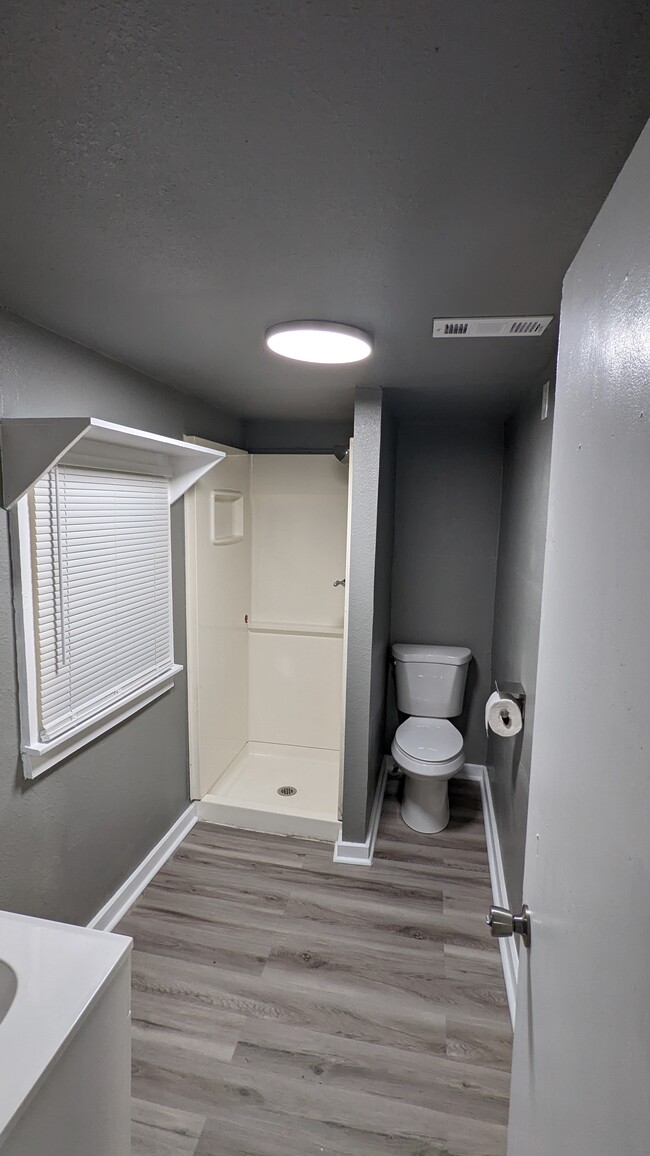 bathroom facing toilet and shower - 600 W Main St