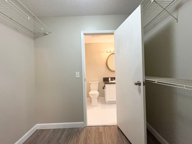 Building Photo - Beautiful Corner Unit with Vinyl Plank Flooring & Private Screened Patio