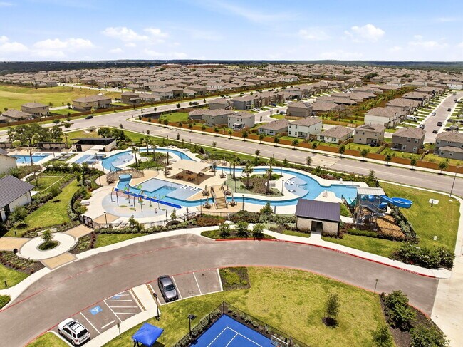 Building Photo - RESORT STYLE AMENITIES!! Multiple Pools. Lazy River. Splash Pad and Water Slides. Fitness Center....