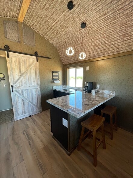 Large kitchen and breakfast bar and induction cooktop. - 8405 N Via Socorro