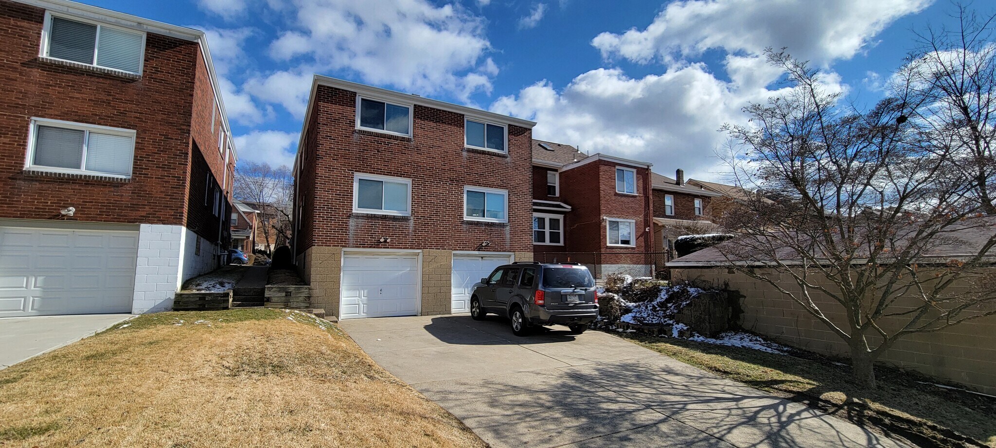 Garage on Right with driveway - 129 Stanton Ct W