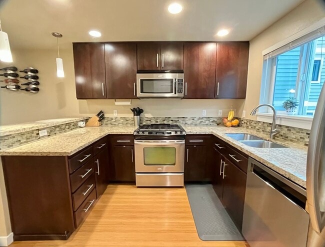 Building Photo - Stylish Greenwood Townhome with Private Patio & Modern Finishes