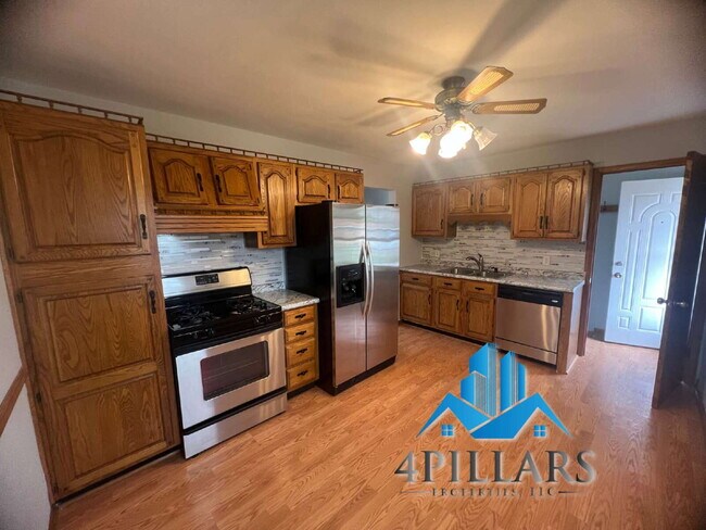 Building Photo - "Charming 3-Bedroom Haven with Finished Basement & Gleaming Hardwood Floors in Hammond!"