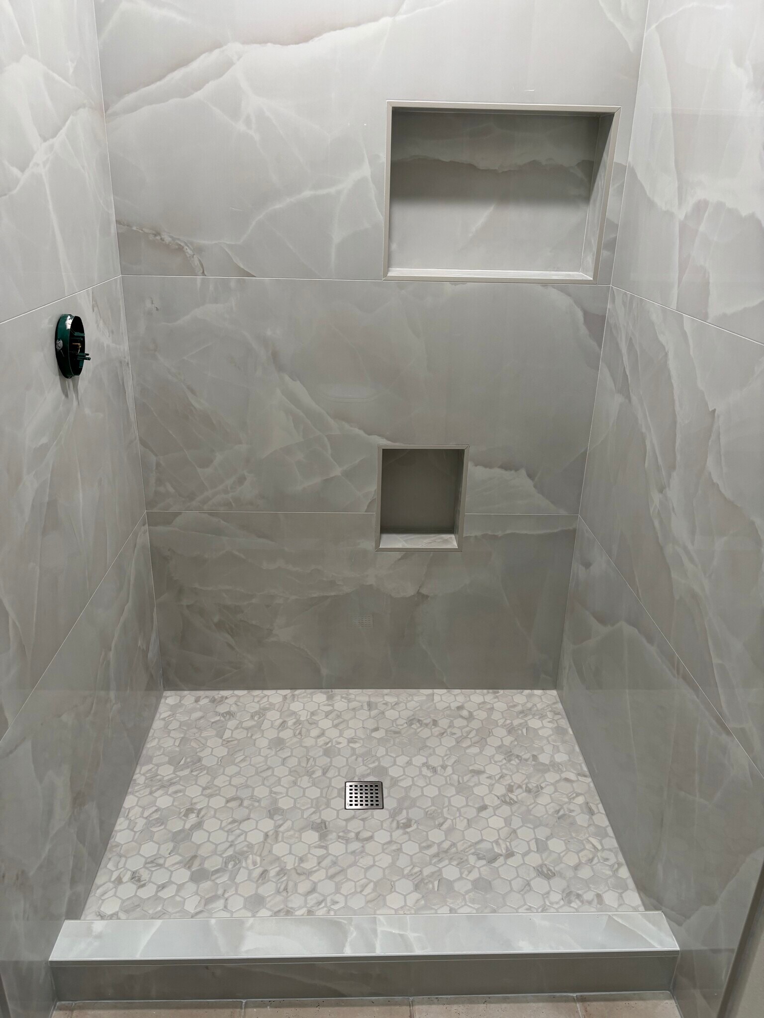 Primary shower has low threshold for easy access & extra lower niche to make leg shaving easier. - 8566 Larkhall Cir