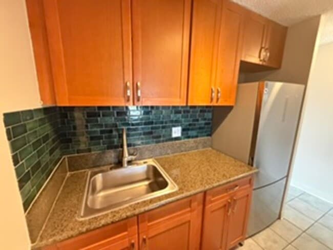 Building Photo - Welcome to your new home at Pearlridge Gardens & Tower! This 1-bedroom, 1-bathroom condo $2,100