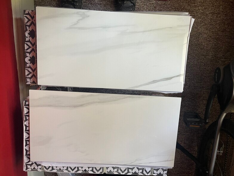 this is the carrara tile that will be installed in the new bath on the floor and tub surround - 418 Clement Ave