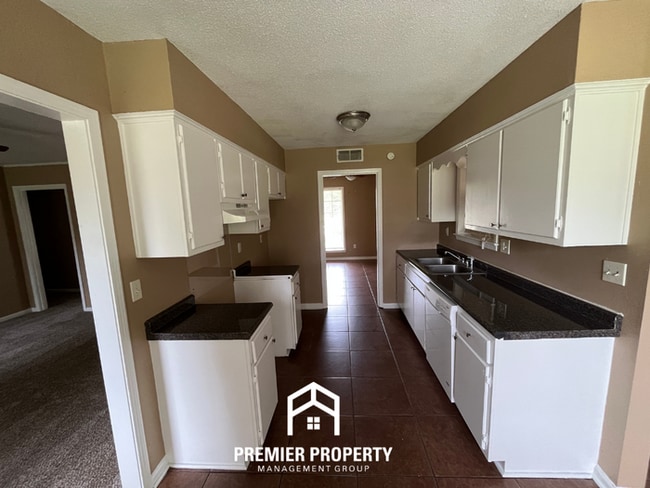 Building Photo - Spacious 4BR/2BA Whitehaven Home | 1,701 Sq Ft, Brick Fireplace & Quiet Cove