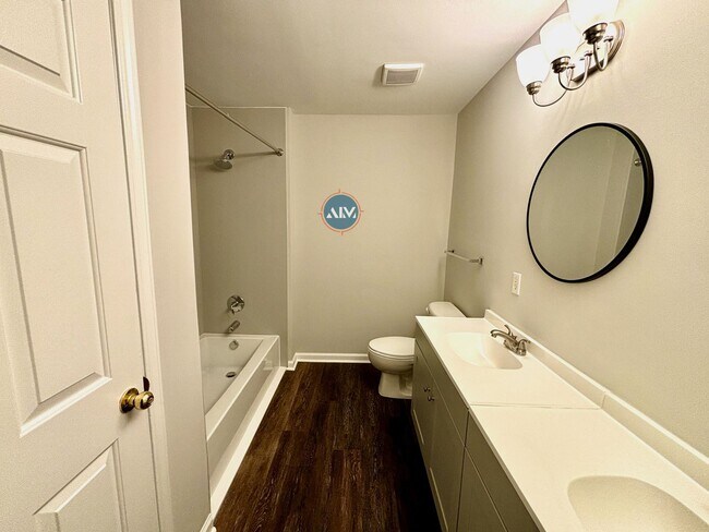 Building Photo - Modern 3-Bed Condo: Lovely Appliances, LVP...