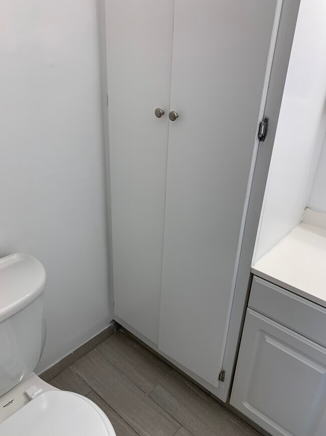 bath #1 tall linen tower - 3877 Herschel St