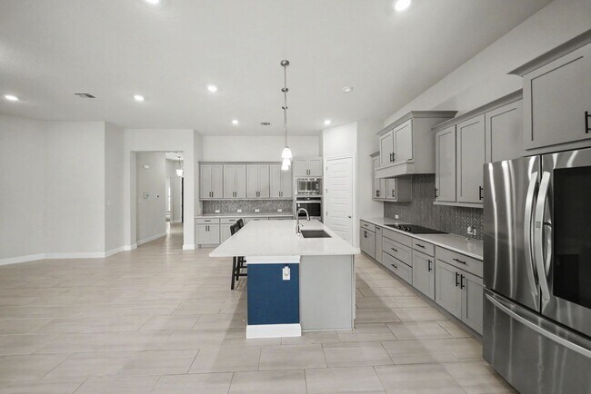 Building Photo - Stunning 4BR Home with 3-Car Garage in Turning Stone - Realtor Commission: $750