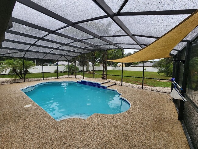 Building Photo - Gorgeous Riverfront 3/3 Saltwater Pool Hom...