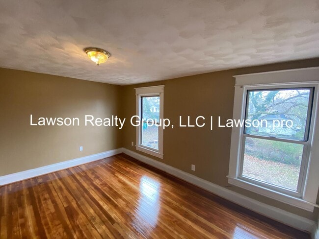 Building Photo - Updated Three Bedroom with Flat Yard