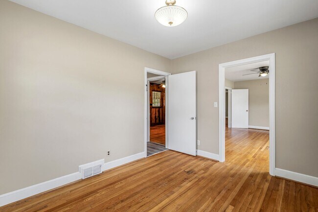 Building Photo - Large Renovated Ranch Home, Two Kitchens & Two Living Areas, Hardwood Flooring, Deck, Fenced!