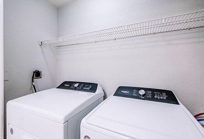 Building Photo - Spacious 2-Bedroom Elite Apartment with Private Balconies & Washer/Dryer