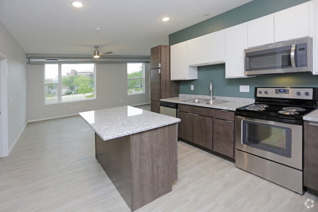 Kitchen with Granite Countertops - Uptown Apartments