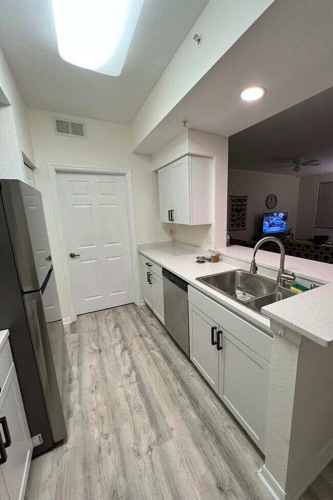 kitchen and laundry room - 4690 Saint Croix Ln