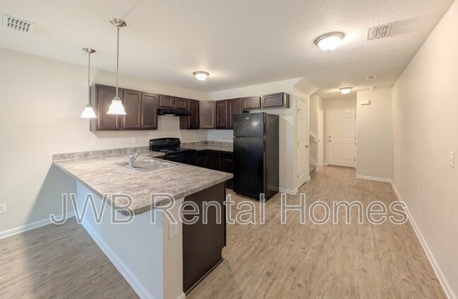 Building Photo - 8445 McGirts Village Ln