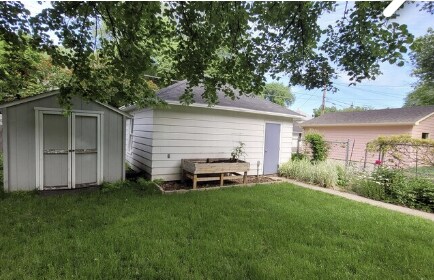Backyard with shed, planter, and garage - 1121 6th St S
