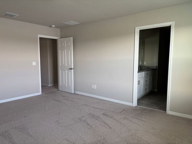 Building Photo - Like-New 4 Bedroom 3 Bath with Pond View & Two Living Spaces — Minutes to South Lake Nona