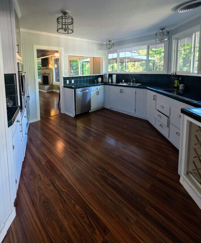 Building Photo - Breathtaking Home offers flexible living with bonus rooms ideal for an office, art studio, gym, o...