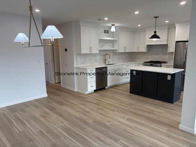 Building Photo - Fully Redesigned Townhouse Style Condo For Rent in Desirable Louisquisset Community!