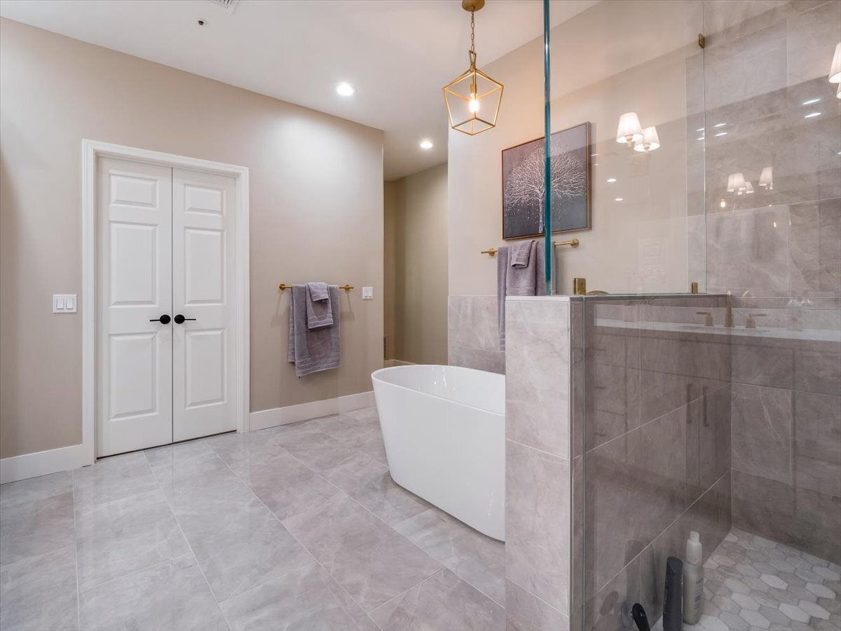 Master Bath with deep soaking tub, large shower and private toilet room - 8437 N 84th St