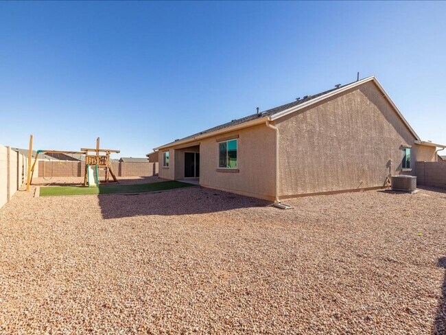 Building Photo - Spacious 4-Bedroom Home with Open Layout & Turf Backyard