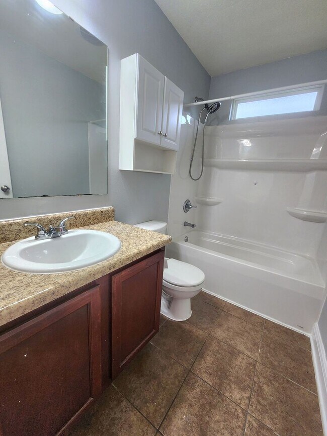 Building Photo - Welcome to your 4/2 dream home in Pace Mil...