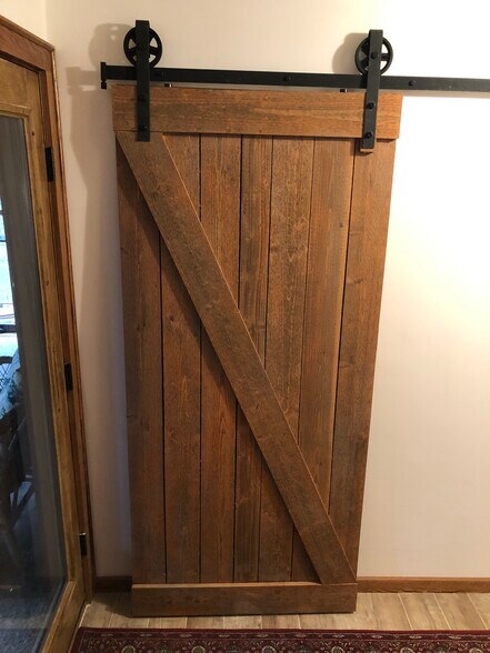 Barn door to entry way closet - 23260 Bridgestone Rd NW