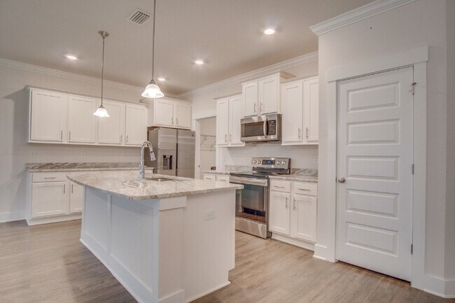 Building Photo - Spacious Cantonment Townhome with Open Layout, 2-Car Garage, Covered Back Porch & Easy Access to ...