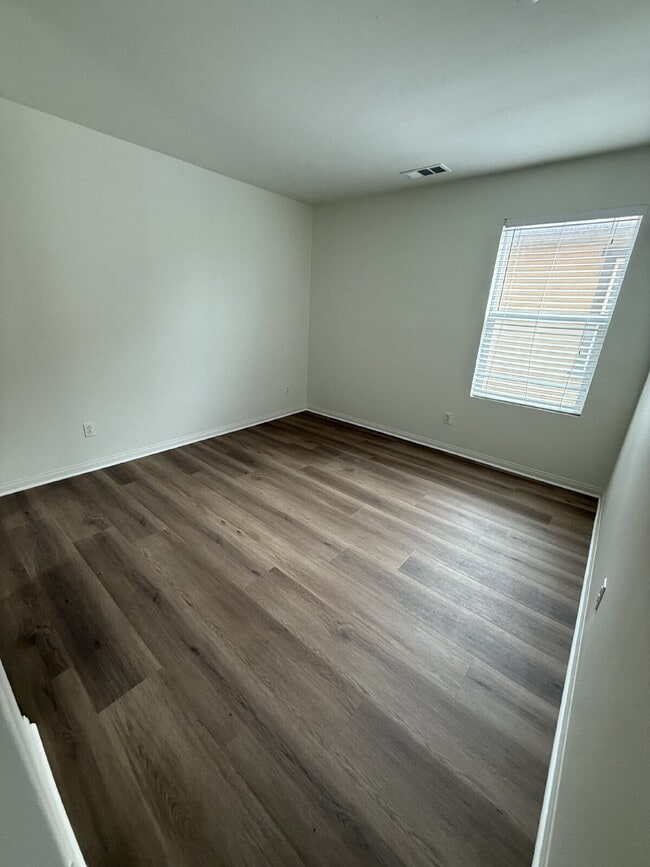 Building Photo - New flooring & paint!  Large backyard - landscaped and ready for garden!   Community pool, fitnes...