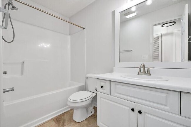 Building Photo - RENT SPECIAL! Freshly Painted! New Luxury Vinyl Plank Floors! Updated Lighting! Pool View Unit! C...