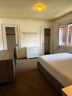 Single bedroom from entry with chested drawers +2 sliding door closets - 2615 Parker St