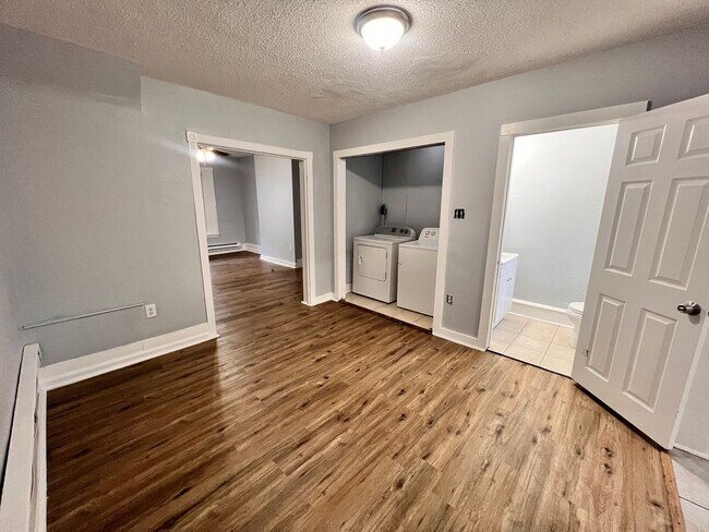 Building Photo - Updated 3 Bedroom 1.5 Bath Townhome w/ Paved Yard + Washer & Dryer