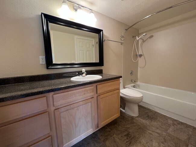 Building Photo - Roomy Top Floor Condo - Budget Friendly, W...