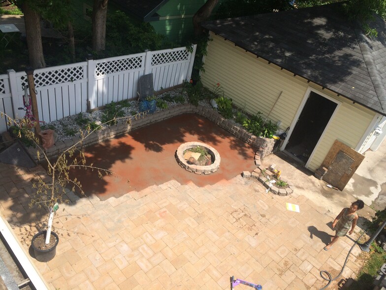 Backyard, fuly fenced, with a firepit and propane grill - 3517 19th Ave S