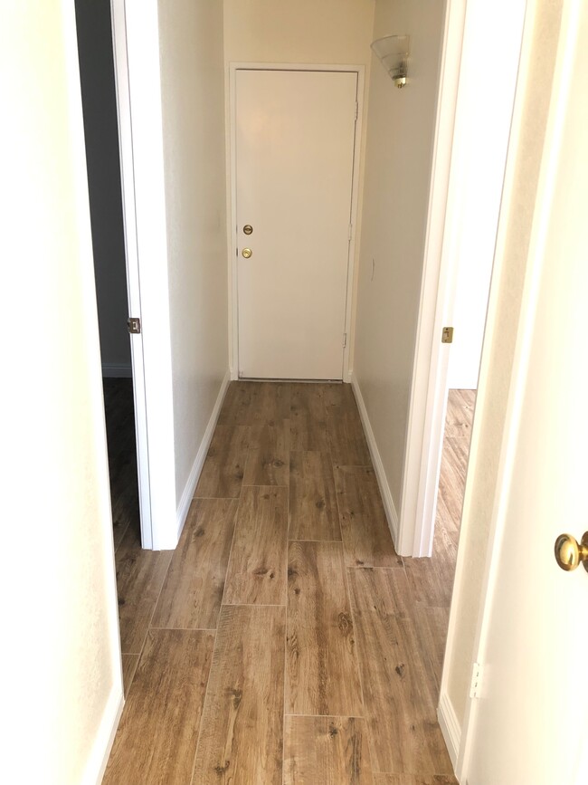 Hallway Facing Garage Door and North and South Bedrooms - 3109 Titcher Ln