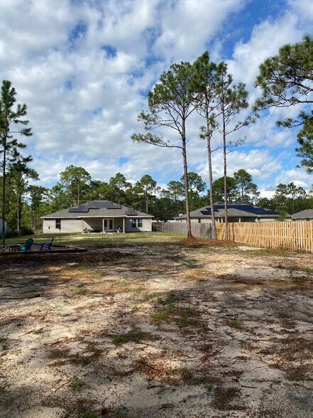 Back yard view from the half basketball court - 9009 Quail Roost Dr