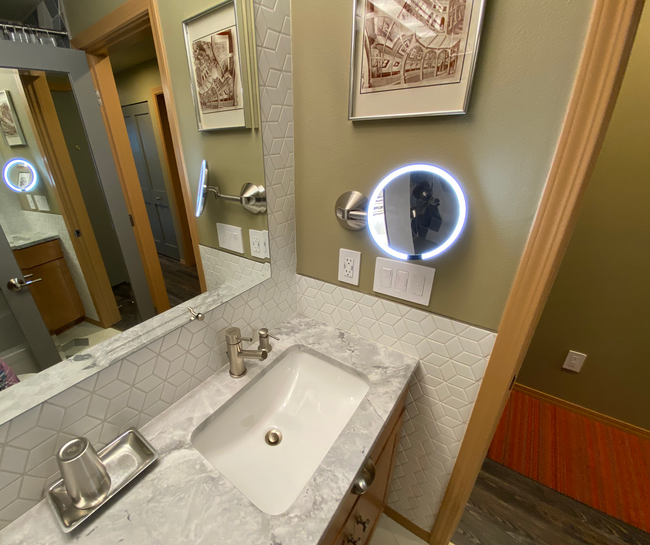 Bathroom with lighted vanity mirror - 3435 California Ave SW