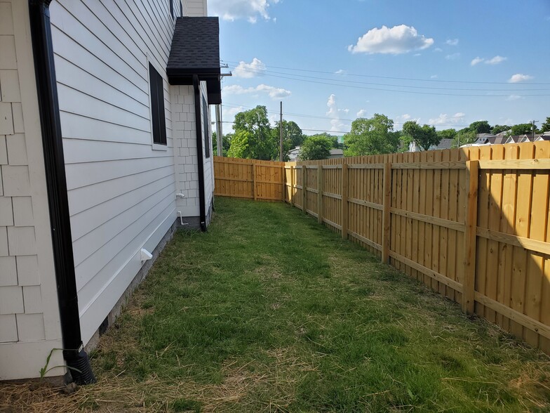 Spacious yard is fully fenced. - 1021 Cheatham Pl
